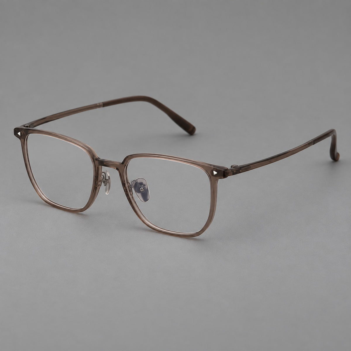 Refined rectangular plastic eyeglasses with raised outer corners and clear nose pads in Brown, three quarter view