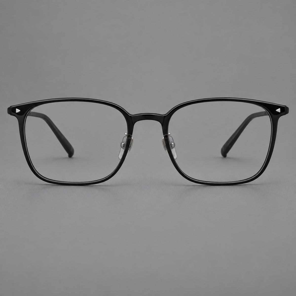 Classic soft square plastic eyeglasses with a gently curved browline and corner studs in Glossy Black, front view
