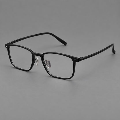 Clean rectangular plastic eyeglasses with flat lower rims and pointed corner details in Glossy Black, three quarter view