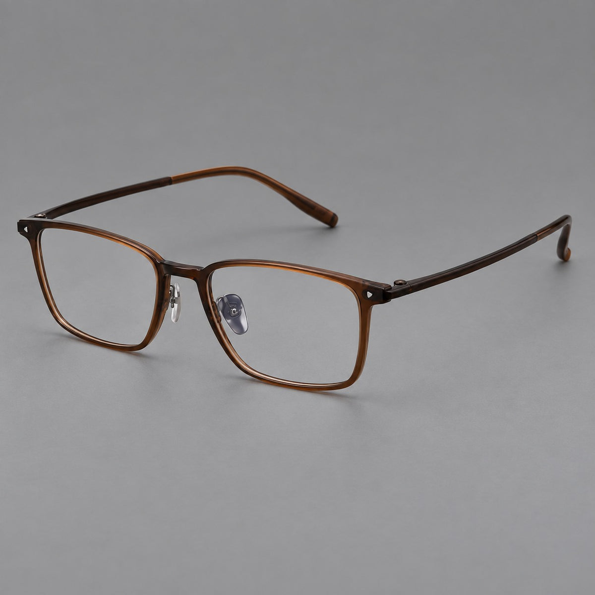 Clean rectangular plastic eyeglasses with flat lower rims and pointed corner details in Tea Brown, three quarter view