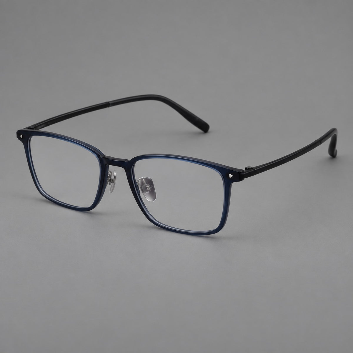 Clean rectangular plastic eyeglasses with flat lower rims and pointed corner details in Blue, three quarter view