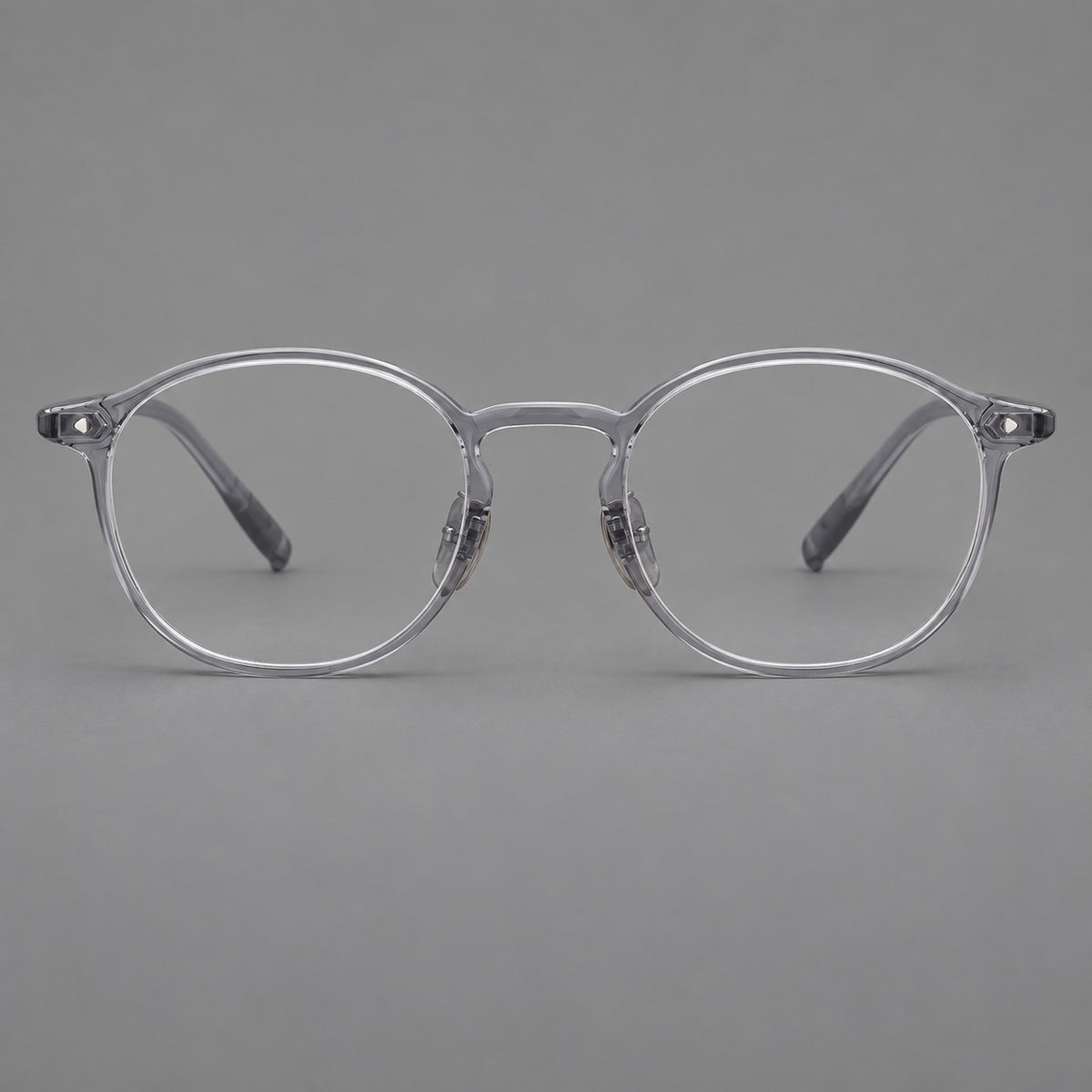 Vintage round plastic eyeglasses with a curved bridge and subtle triangular accents in Light Grey, front view