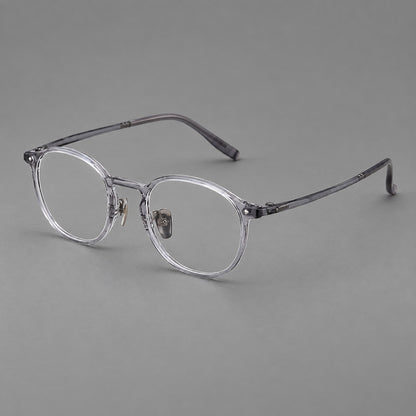 Vintage round plastic eyeglasses with a curved bridge and subtle triangular accents in Light Grey, three quarter view front view