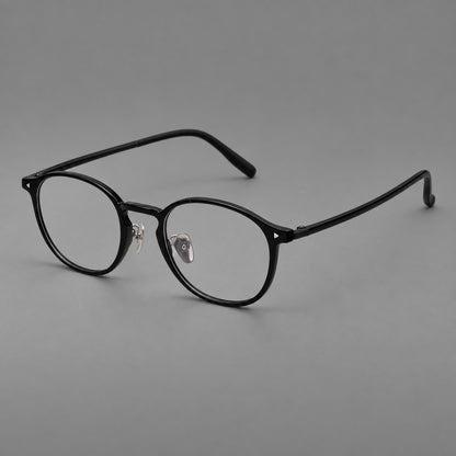Vintage round plastic eyeglasses with a curved bridge and subtle triangular accents in Glossy Black, three quarter view