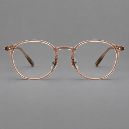 Vintage round plastic eyeglasses with a curved bridge and subtle triangular accents in Tea, front view temple detail