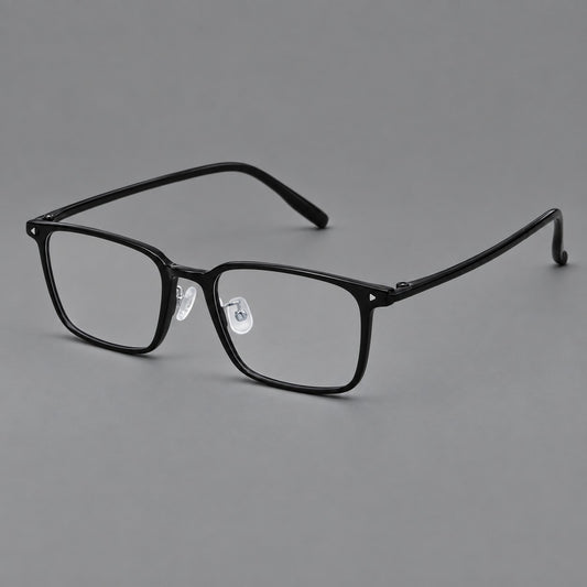 Everyday rectangular plastic eyeglasses with rounded edges and a narrow bridge in Glossy Black, three quarter view