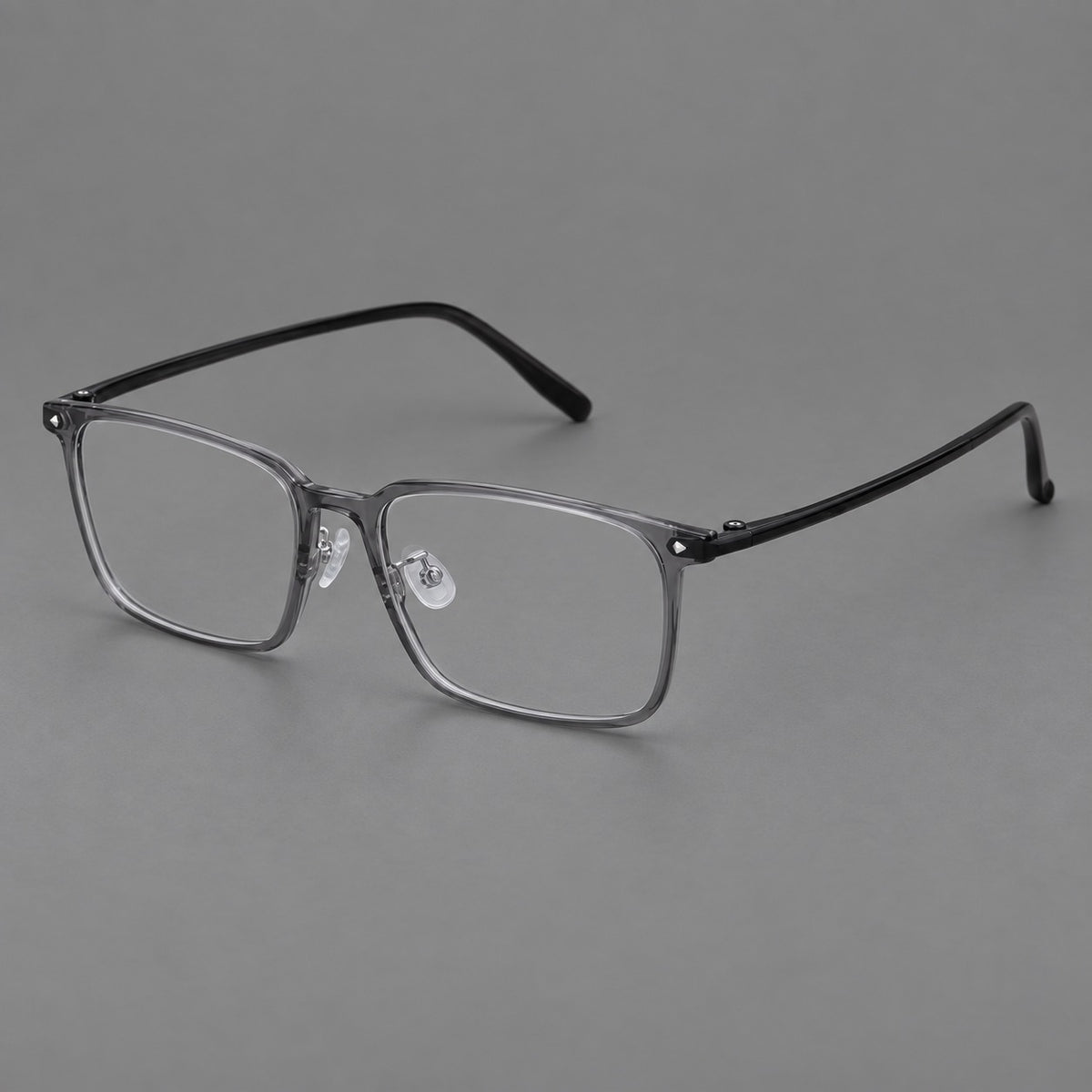 Wide rectangular plastic eyeglasses with an angular browline and slender rims in Medium Grey, three quarter view