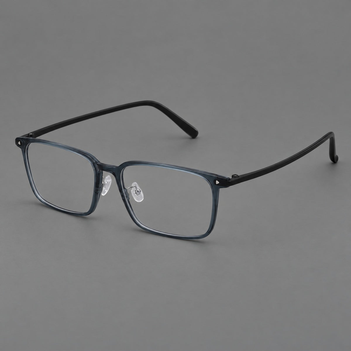 Wide rectangular plastic eyeglasses with an angular browline and slender rims in Blue, three quarter view