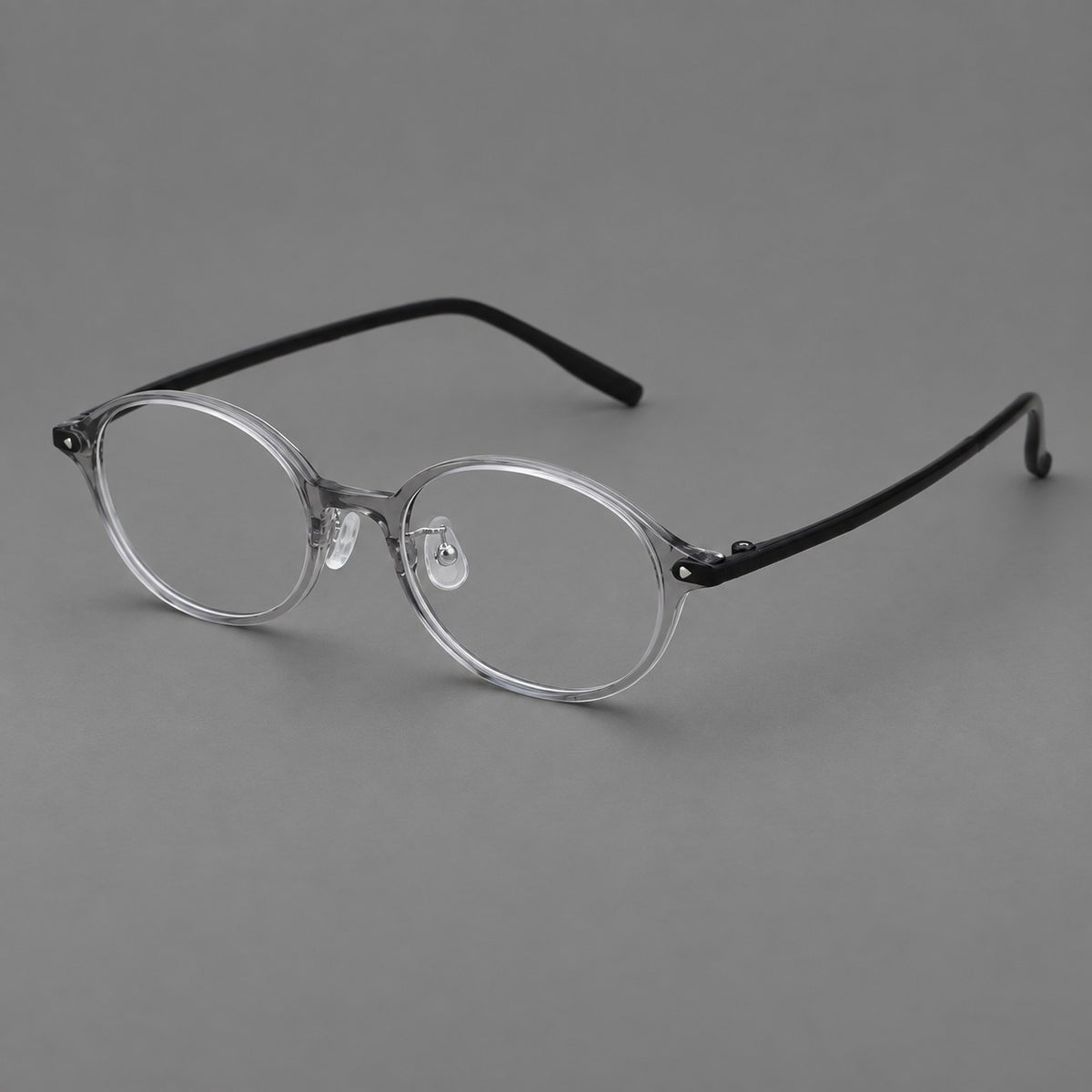 Retro round plastic eyeglasses with softly lifted corners and a sculpted bridge in Grey, three quarter view