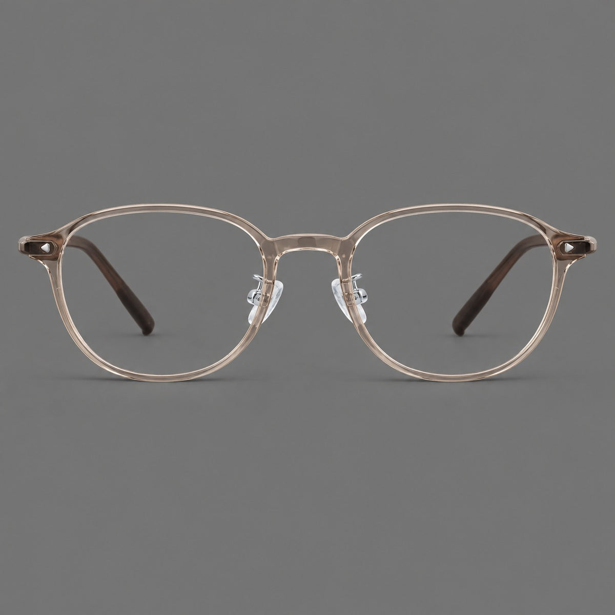 Panto plastic eyeglasses with a rounded silhouette and triangular corner studs in Tea, front view