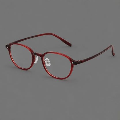 Panto plastic eyeglasses with a rounded silhouette and triangular corner studs in Burgundy, three quarter view lens detail