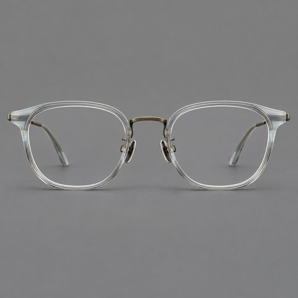 Retro soft square eyeglasses in acetate and titanium with a curved bridge and slender temples in Ice Grey Tortoiseshell / Antique Gold, front view