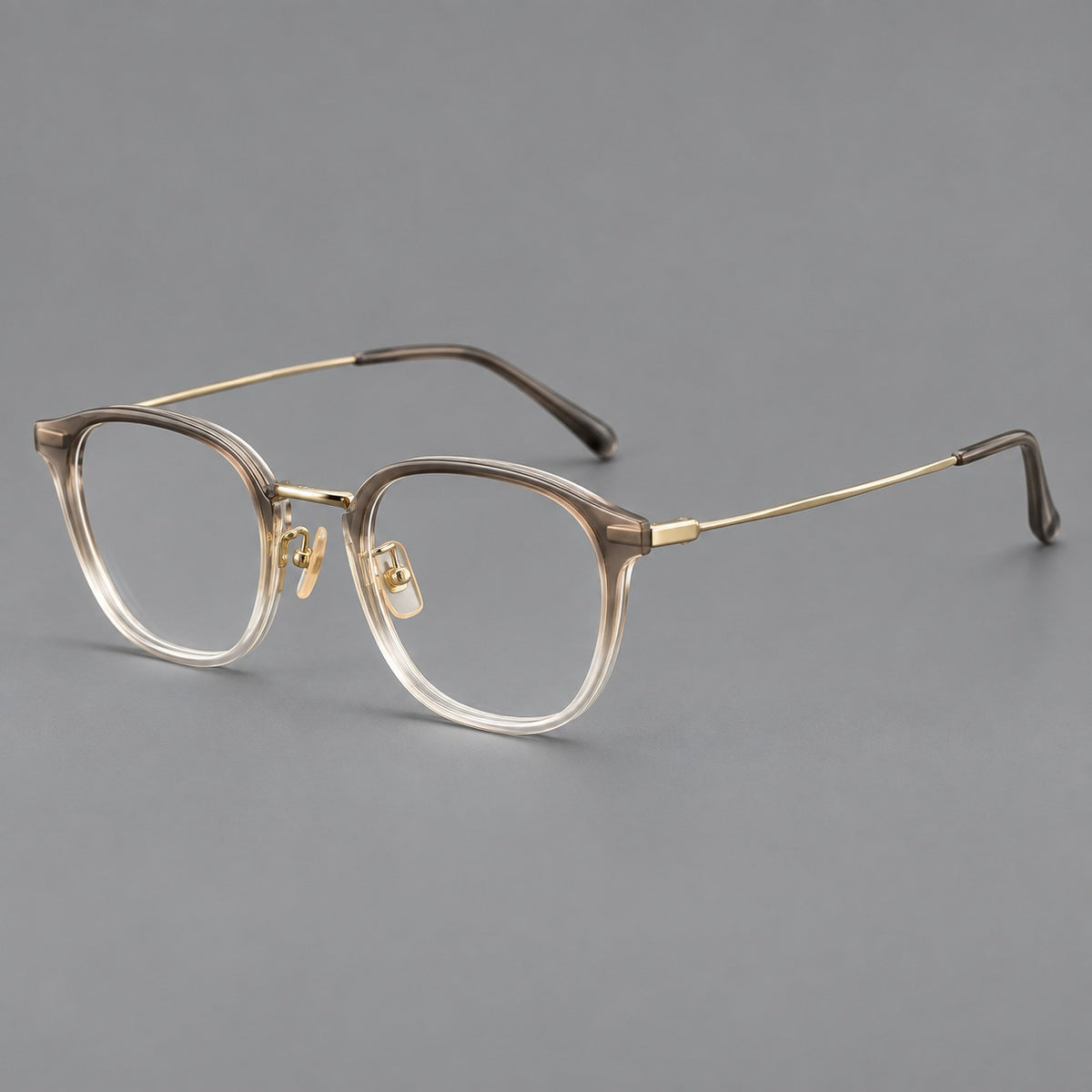 Retro soft square eyeglasses in acetate and titanium with a curved bridge and slender temples in Tea Gradient / Light Gold, three quarter view
