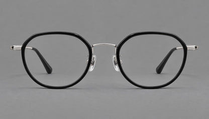 Rounded eyeglasses in acetate and titanium with gently arched brows and engraved metal temples in Black / Silver, front view additional product view