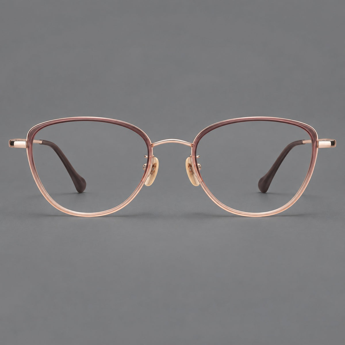 Upswept eyeglasses in acetate and titanium with softly rounded rims and tapered metal temples in Pink Tea Gradient / Rose Gold, front view