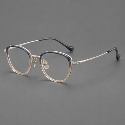 Upswept eyeglasses in acetate and titanium with softly rounded rims and tapered metal temples in Blue Tea Gradient / Gunmetal, three quarter view lens detail