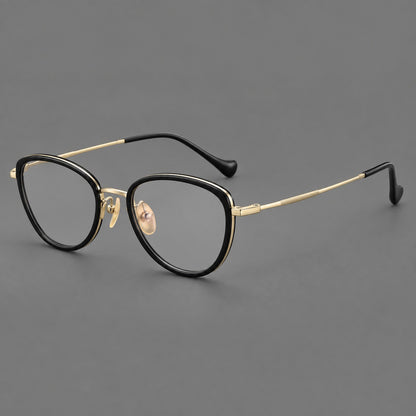 Upswept eyeglasses in acetate and titanium with softly rounded rims and tapered metal temples in Black / Gold, three quarter view additional product view