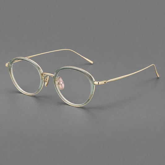Round eyeglasses in acetate and titanium with a slim curved bridge and fine metal temples in Green / Gold, three quarter view