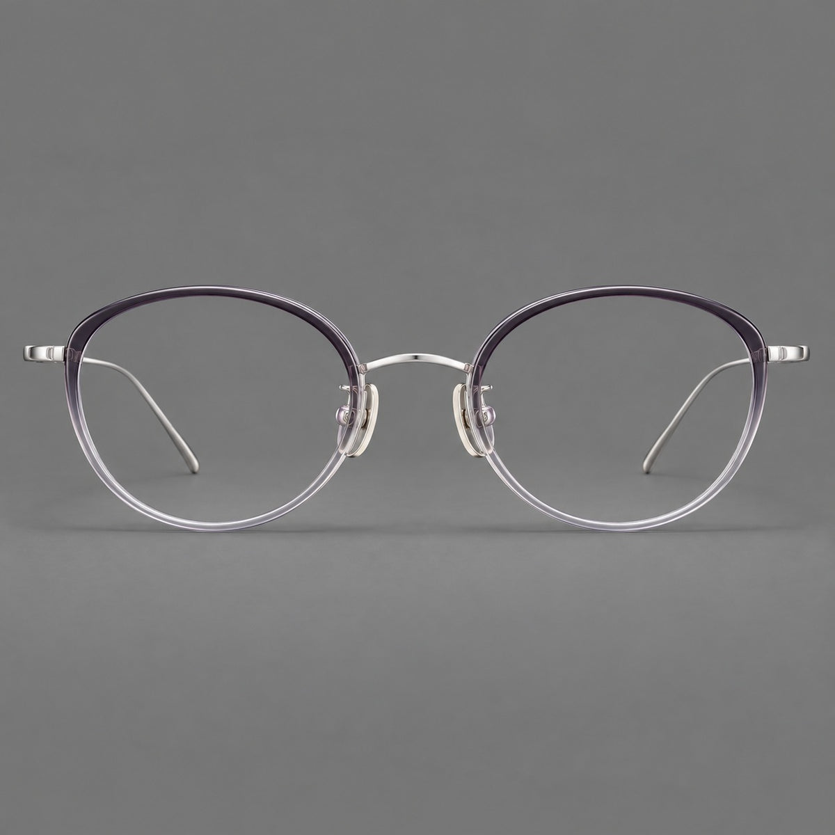 Round eyeglasses in acetate and titanium with a slim curved bridge and fine metal temples in Purple Gradient / Silver, front view