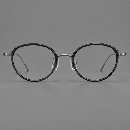 Round eyeglasses in acetate and titanium with a slim curved bridge and fine metal temples in Glossy Black / Gunmetal, front view additional product view