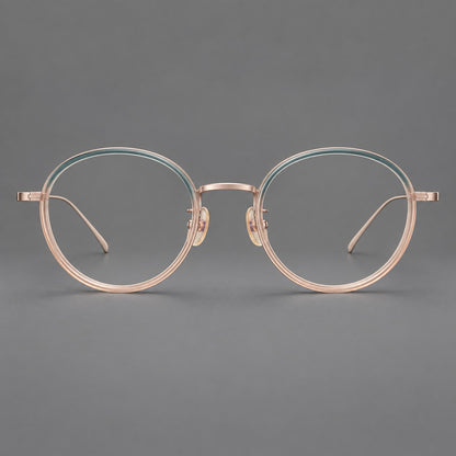 Classic round eyeglasses in acetate and titanium with slim rims and textured metal temples in Blue Tea Gradient / Rose Gold, front view frame detail