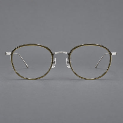 Vintage round eyeglasses in acetate and titanium with an engraved bridge and slender temples in Tea Green / Matte Silver, front view additional product view