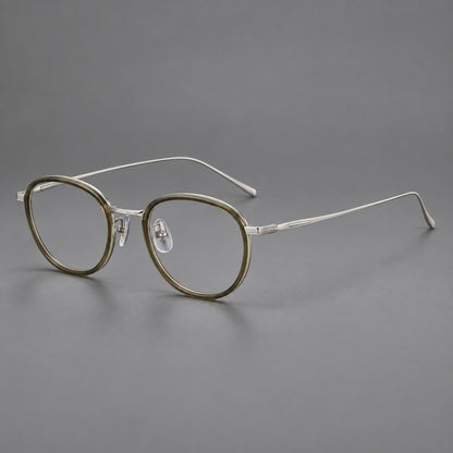 Vintage round eyeglasses in acetate and titanium with an engraved bridge and slender temples in Tea Green / Matte Silver, three quarter view additional product view