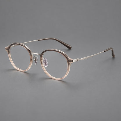 Softly rounded eyeglasses in acetate and titanium with a curved bridge and engraved temples in Tea Pink Gradient / Silver, three quarter view lens detail