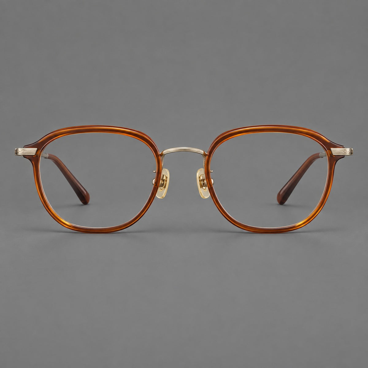 Soft square eyeglasses in acetate and titanium with rounded corners and decorative metal temples in Brown Tortoiseshell / Antique Gold, front view