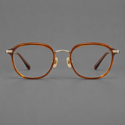 Soft square eyeglasses in acetate and titanium with rounded corners and decorative metal temples in Brown Tortoiseshell / Antique Gold, front view frame detail