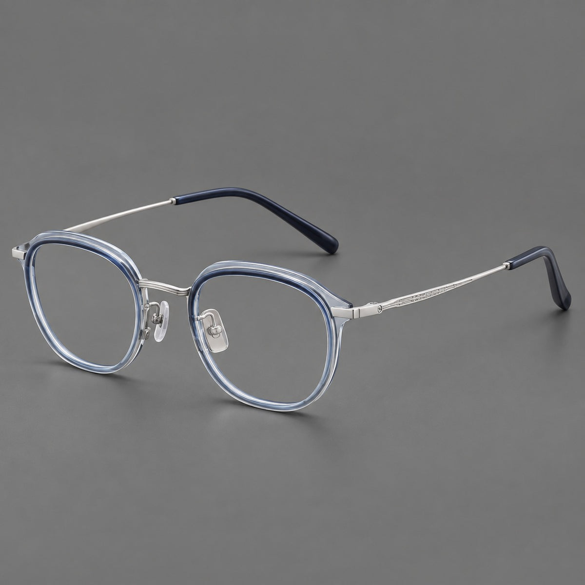 Soft square eyeglasses in acetate and titanium with rounded corners and decorative metal temples in Grey Blue Gradient / Silver, three quarter view