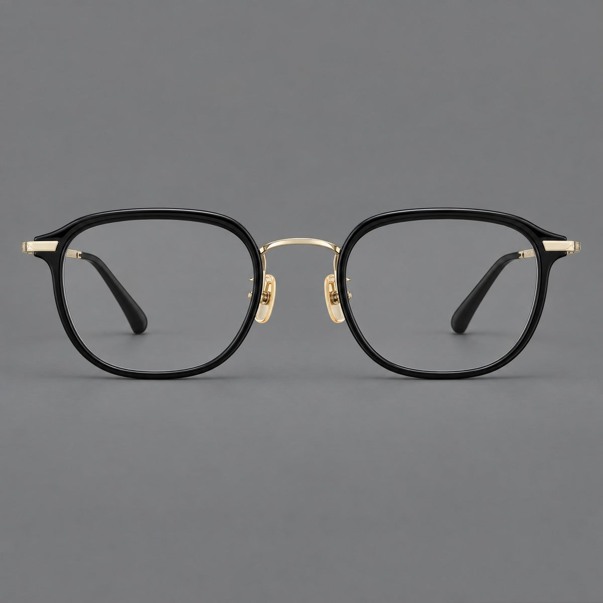 Soft square eyeglasses in acetate and titanium with rounded corners and decorative metal temples in Matte Black / Light Gold, front view