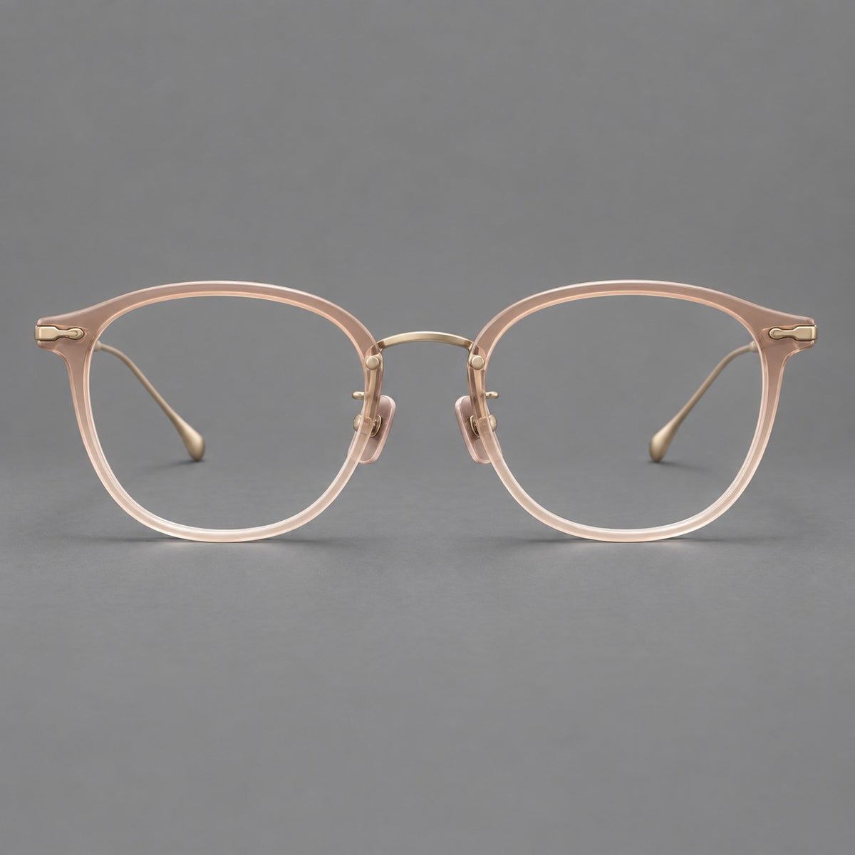 Panto eyeglasses in acetate and titanium with curved brows and decorative metal corner accents in Nude Pink / Gold, front view