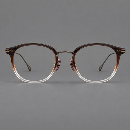 Panto eyeglasses in acetate and titanium with curved brows and decorative metal corner accents in Tea Brown Gradient / Antique Bronze, front view temple detail