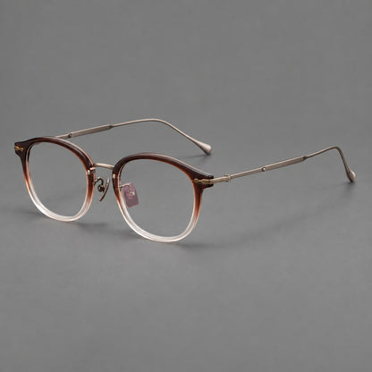 Panto eyeglasses in acetate and titanium with curved brows and decorative metal corner accents in Tea Brown Gradient / Antique Bronze, three quarter view lens detail