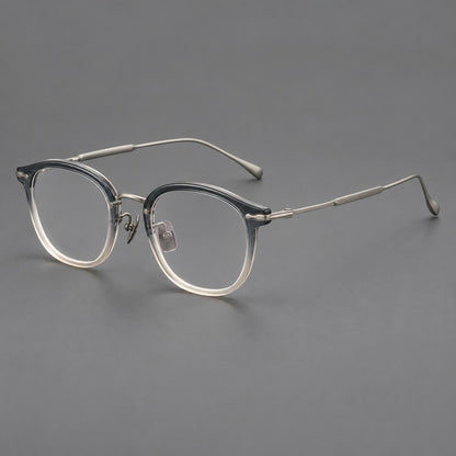 Panto eyeglasses in acetate and titanium with curved brows and decorative metal corner accents in Ice Blue Tea / Silver, three quarter view additional product view