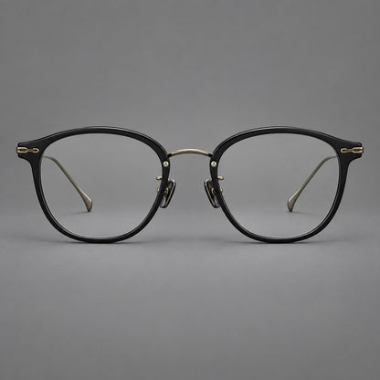 Panto eyeglasses in acetate and titanium with curved brows and decorative metal corner accents in Glossy Black / Antique Bronze, front view additional product view