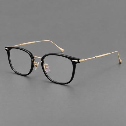 Retro square eyeglasses in acetate and titanium with rounded edges and sculpted corner accents in Glossy Black / Gold, three quarter view additional product view