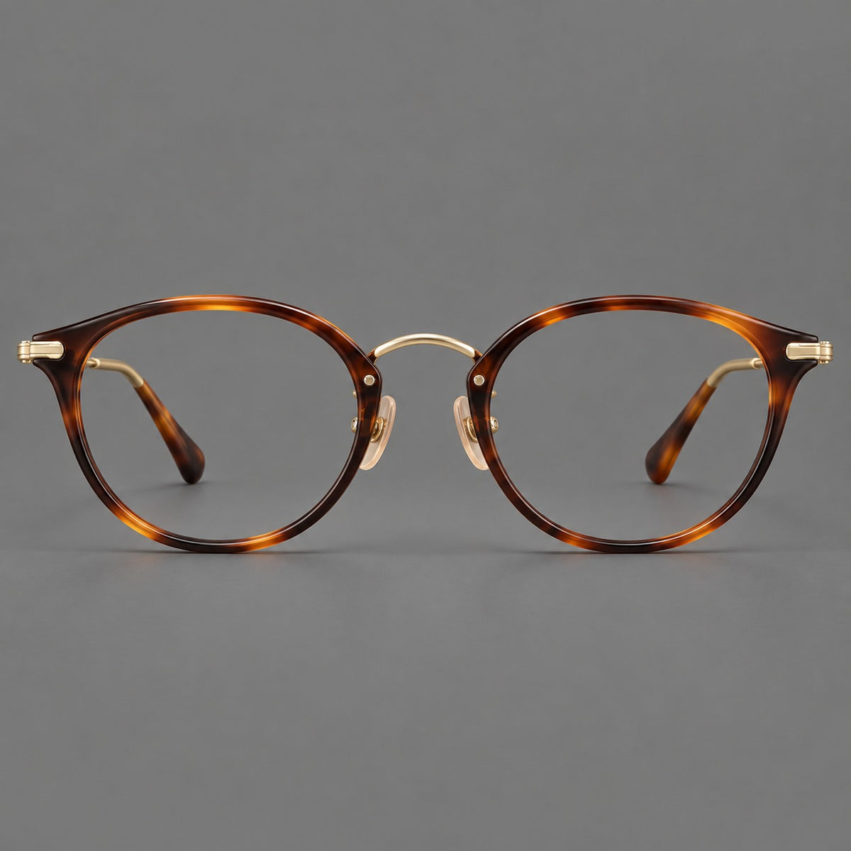 Vintage panto eyeglasses in acetate and titanium with raised brows and textured metal temples in Tortoiseshell / Gold, front view