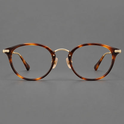 Vintage panto eyeglasses in acetate and titanium with raised brows and textured metal temples in Tortoiseshell / Gold, front view side view