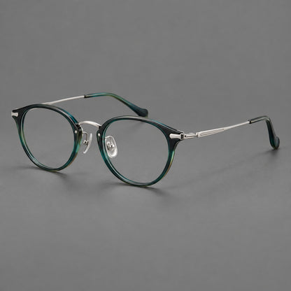 Vintage panto eyeglasses in acetate and titanium with raised brows and textured metal temples in Peacock Blue / Silver, three quarter view front view