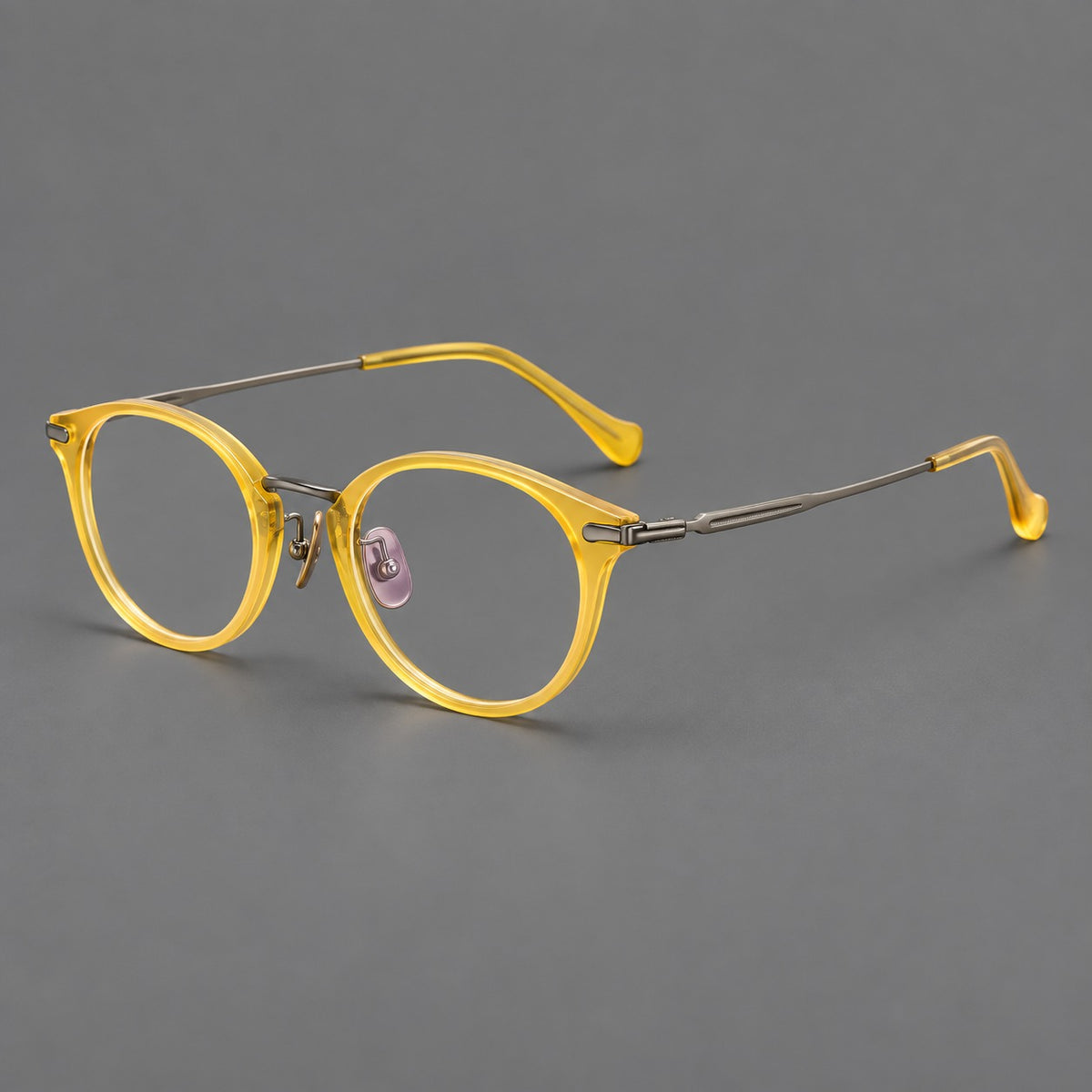 Vintage panto eyeglasses in acetate and titanium with raised brows and textured metal temples in Lemon Yellow / Gunmetal, three quarter view