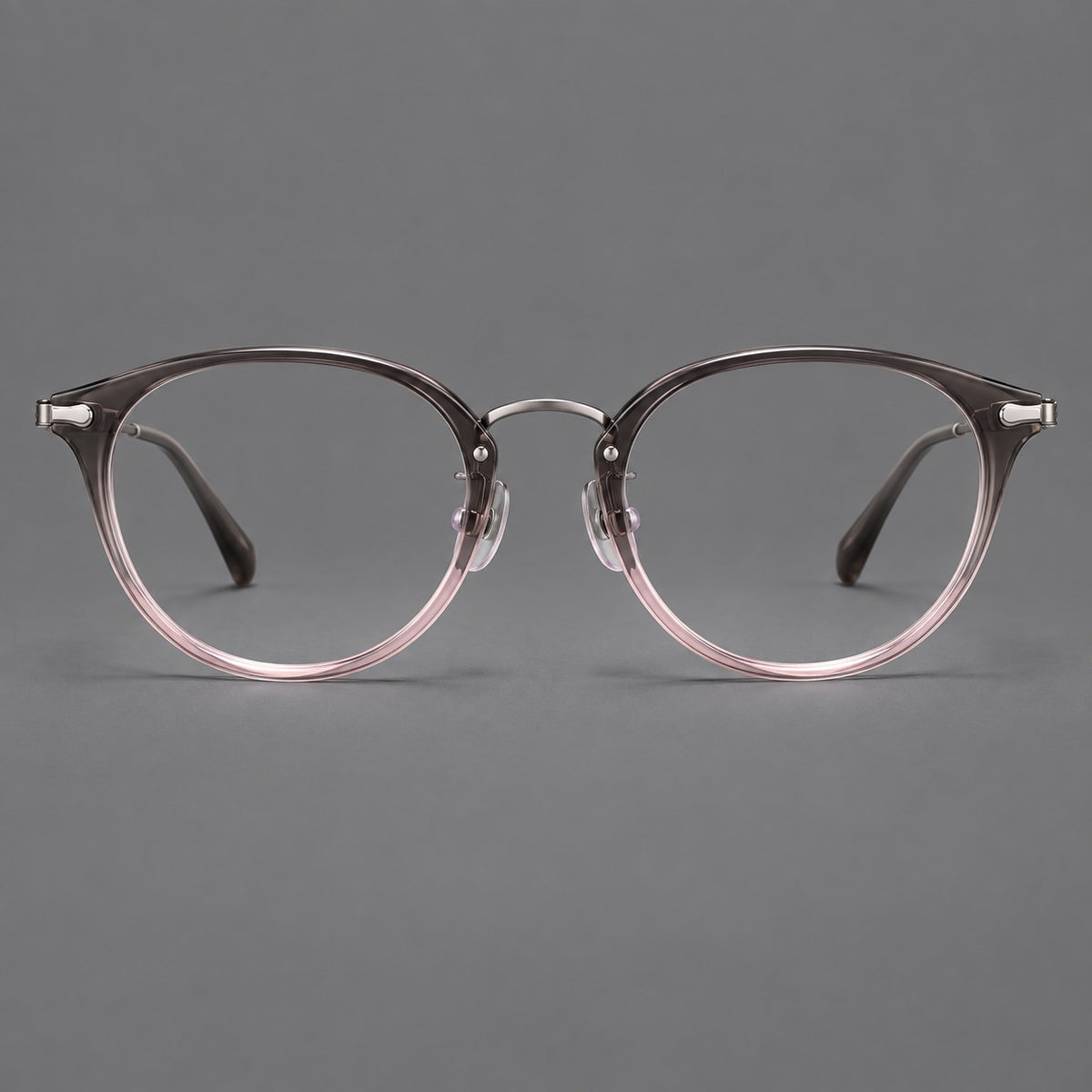 Vintage panto eyeglasses in acetate and titanium with raised brows and textured metal temples in Mist Pink Gradient / Gunmetal, front view