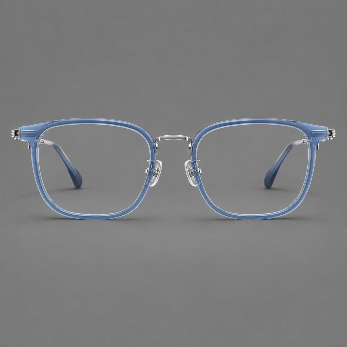 Soft square eyeglasses in acetate and titanium with wide upper corners and fine metal temples in Clear Blue / Silver, front view