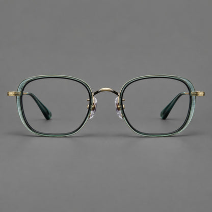 Rounded square eyeglasses in acetate and titanium with an arched bridge and engraved temples in Misted Clear Green / Antique Gold, front view frame detail