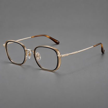 Rounded square eyeglasses in acetate and titanium with an arched bridge and engraved temples in Black and Clear Tea / Light Gold, three quarter view lens detail
