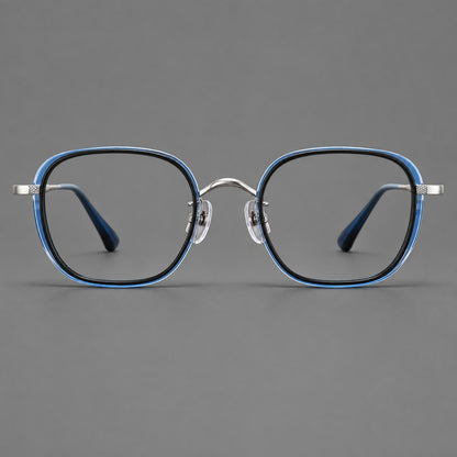 Rounded square eyeglasses in acetate and titanium with an arched bridge and engraved temples in Black and Clear Blue / Silver, front view additional product view