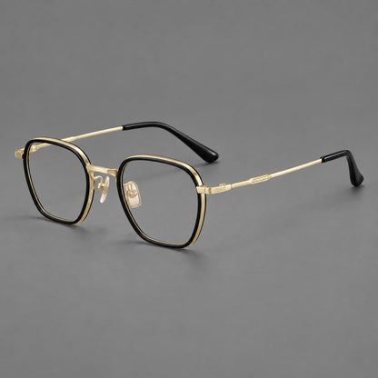 Soft square eyeglasses in acetate and titanium with slim rims and a finely engraved metal bridge in Glossy Black / Gold, three quarter view lens detail