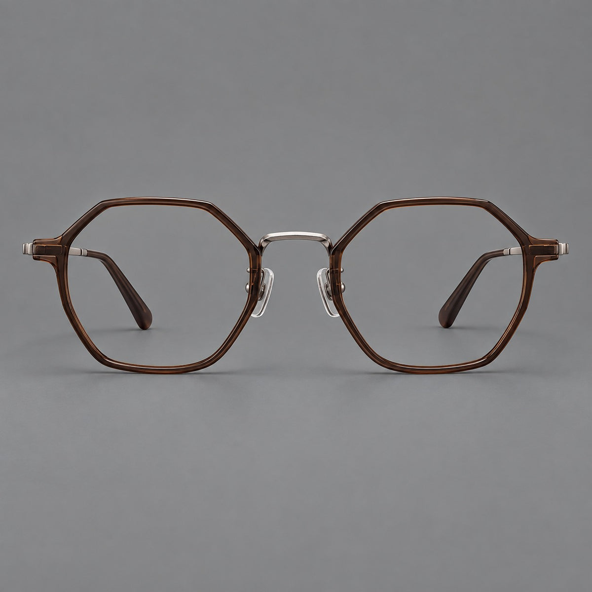 Geometric eyeglasses in acetate and titanium with octagonal rims and a textured metal bridge in Warm Tea Brown / Light Gunmetal, front view
