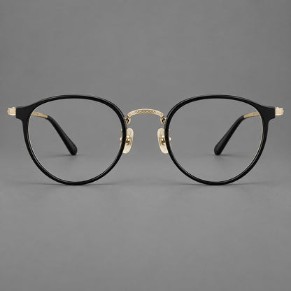 Round eyeglasses in acetate and titanium with widened outer corners and slender metal temples in Glossy Black / Gold, front view temple detail
